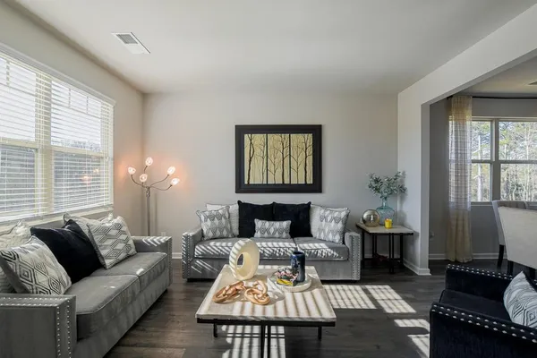 a living room with furniture and a window