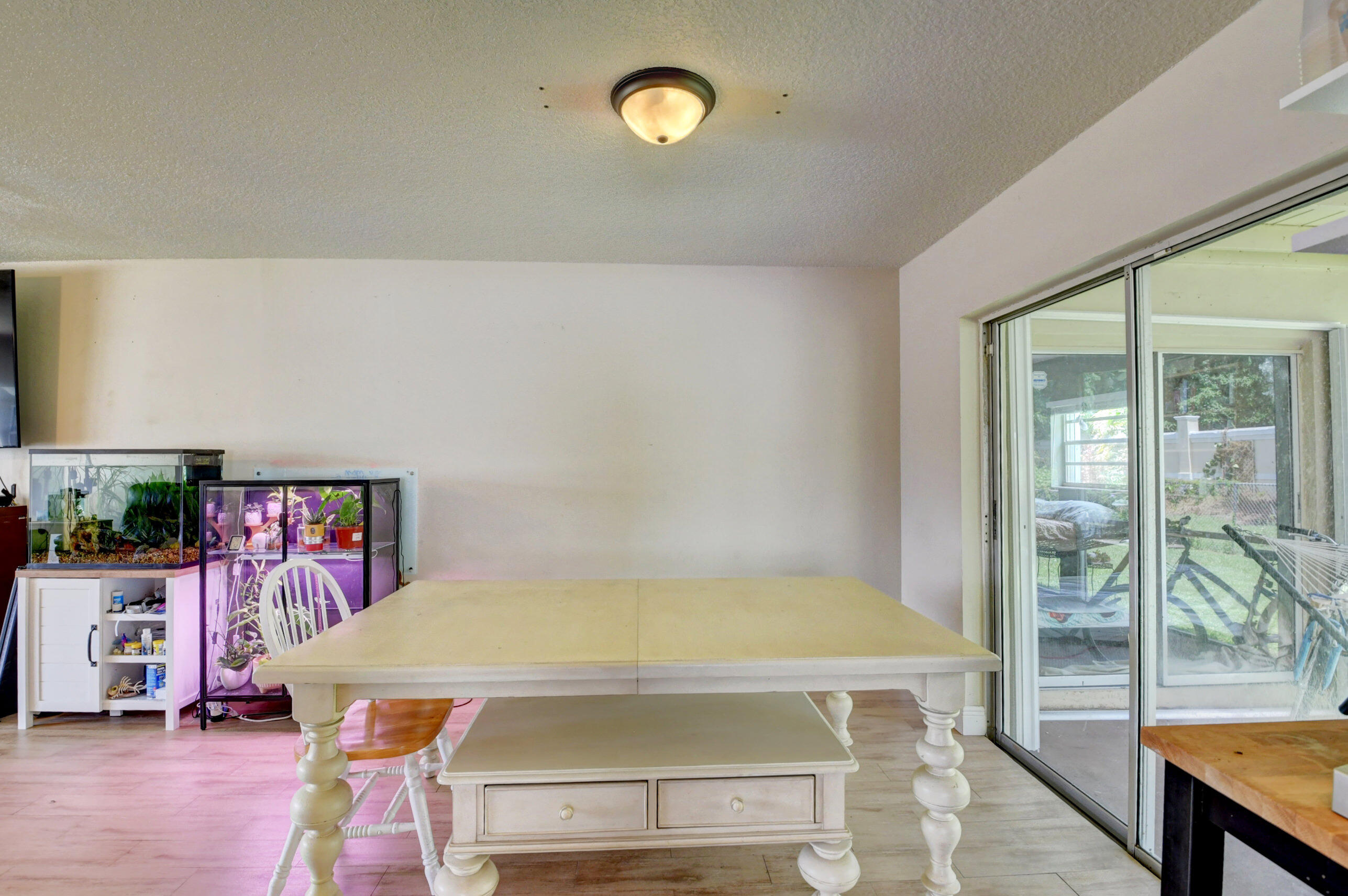 22093 Southwest 58th Avenue Boca Raton, FL 33428 - Photo 12 of 36 a bed sitting in a bedroom next to a window