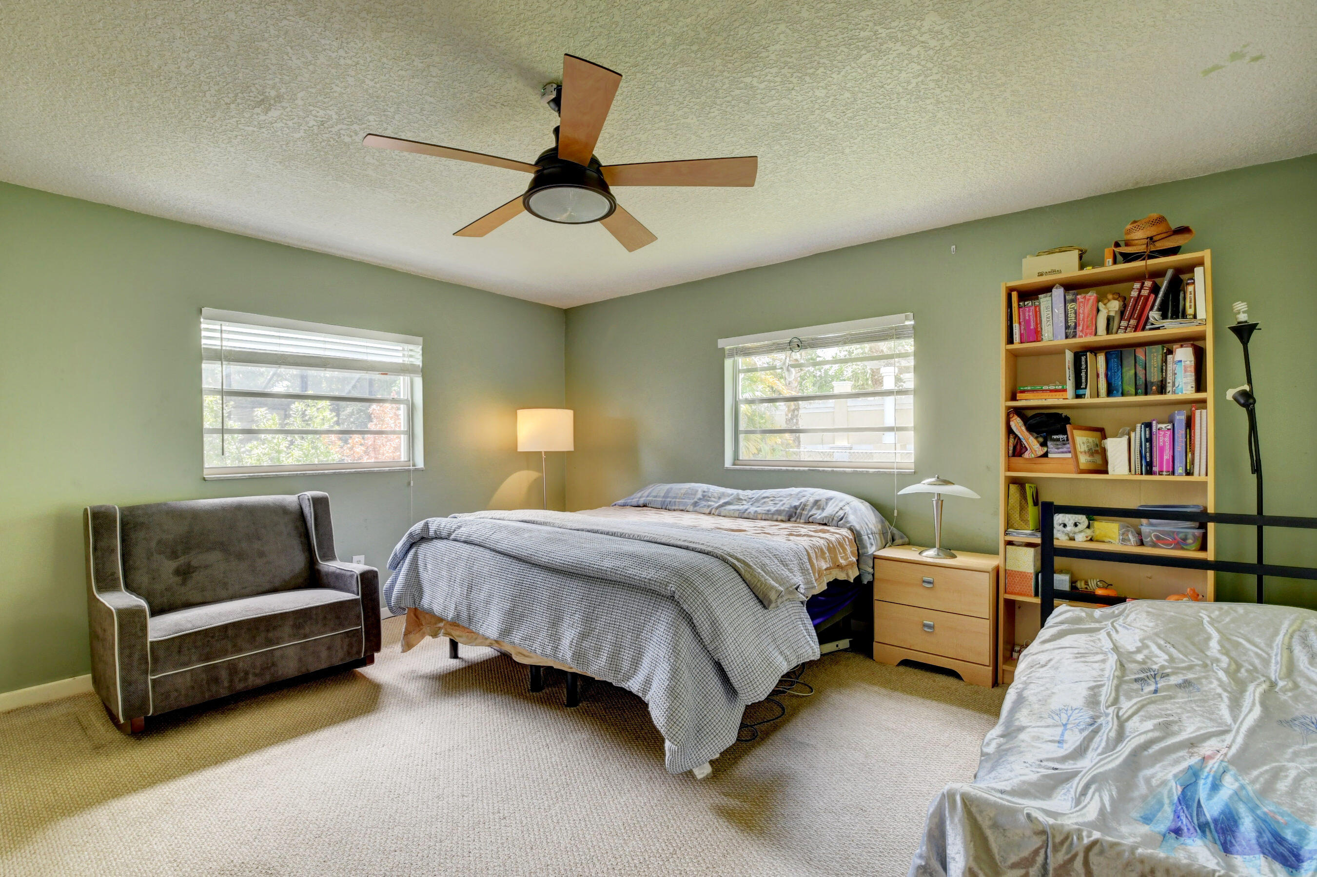 22093 Southwest 58th Avenue Boca Raton, FL 33428 - Photo 18 of 36 a spacious bedroom with a bed and a window