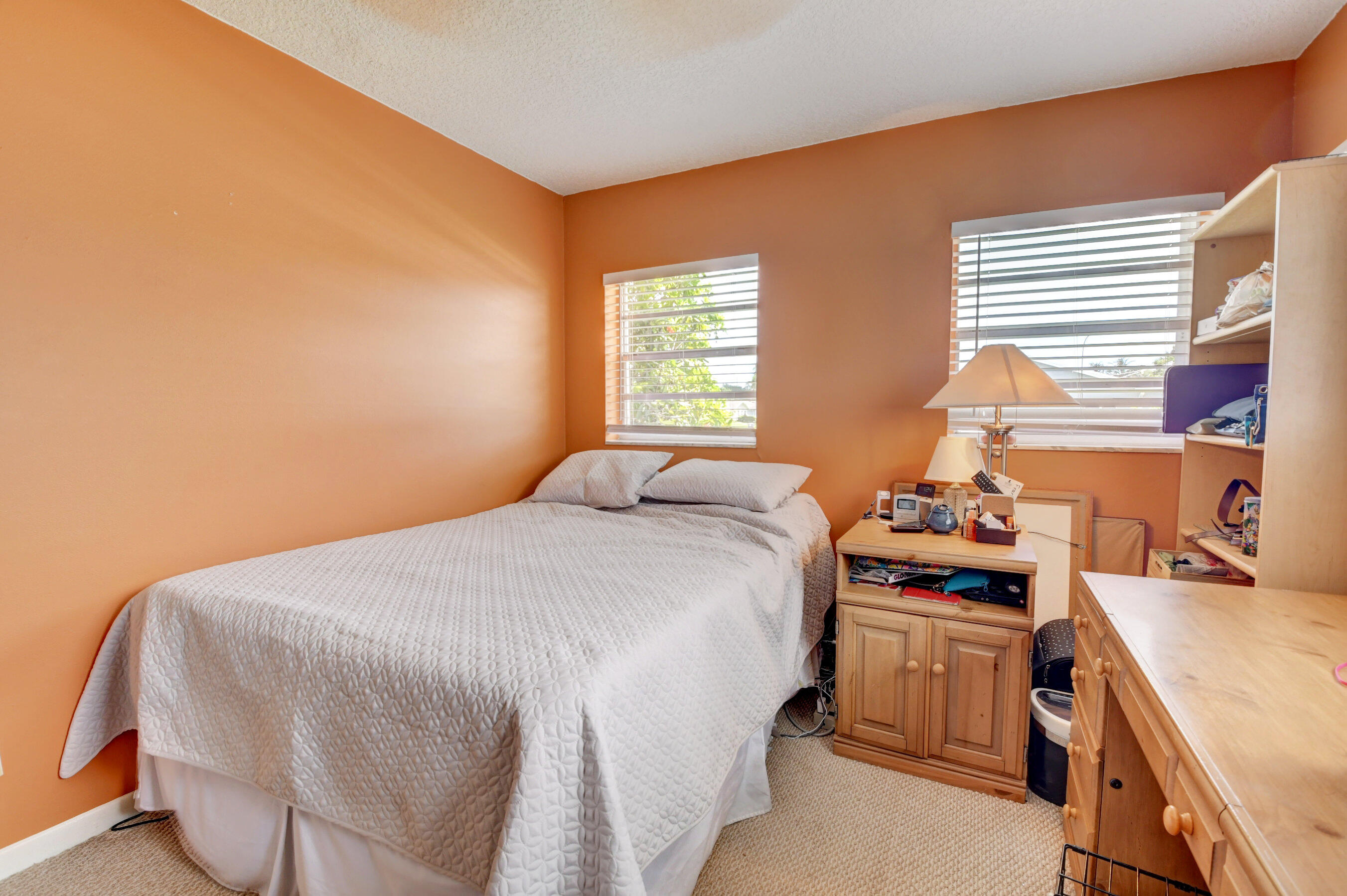 22093 Southwest 58th Avenue Boca Raton, FL 33428 - Photo 19 of 36 a bedroom with a bed and a window