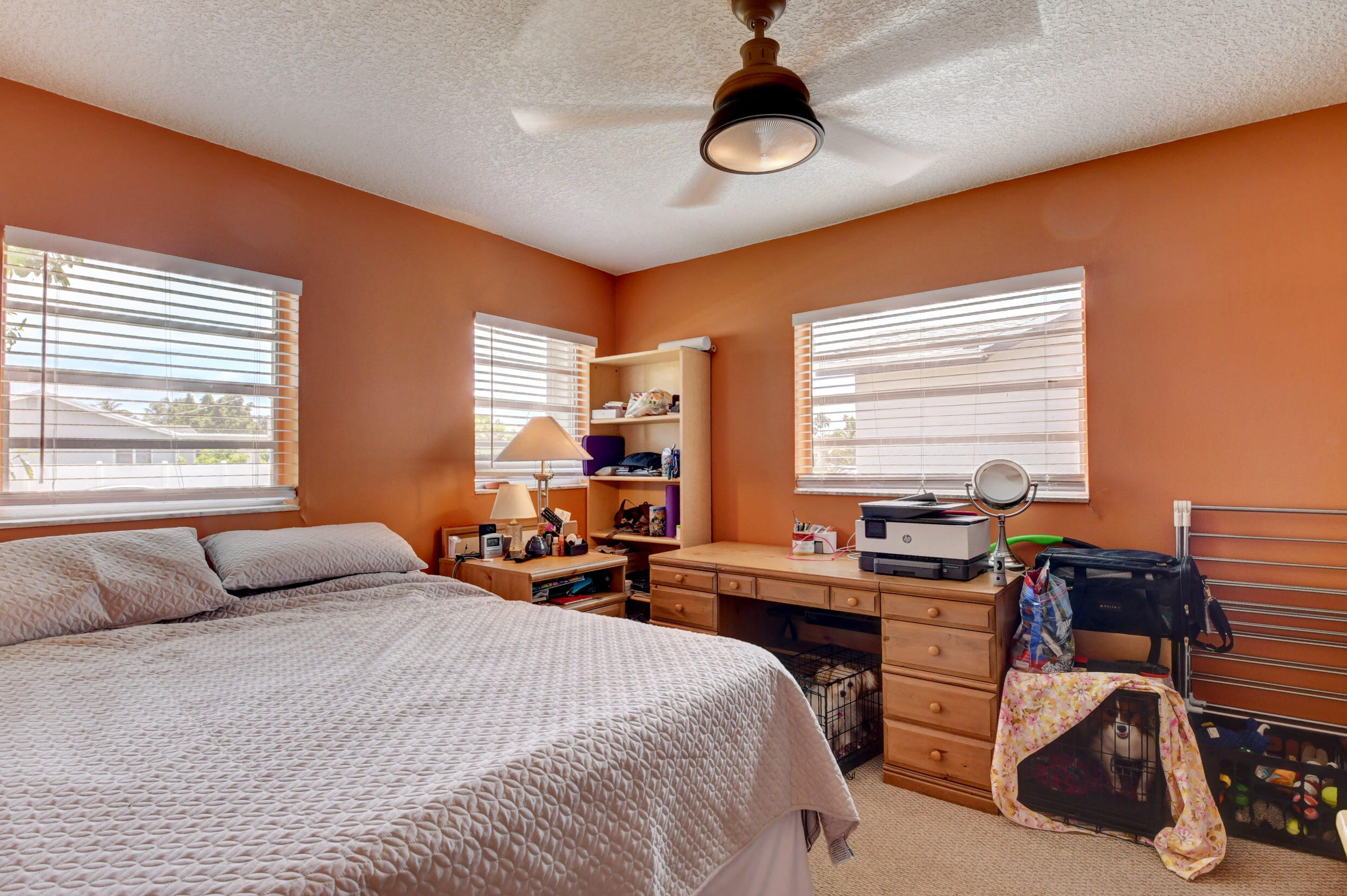 22093 Southwest 58th Avenue Boca Raton, FL 33428 - Photo 20 of 36 a bedroom with a bed and a desk