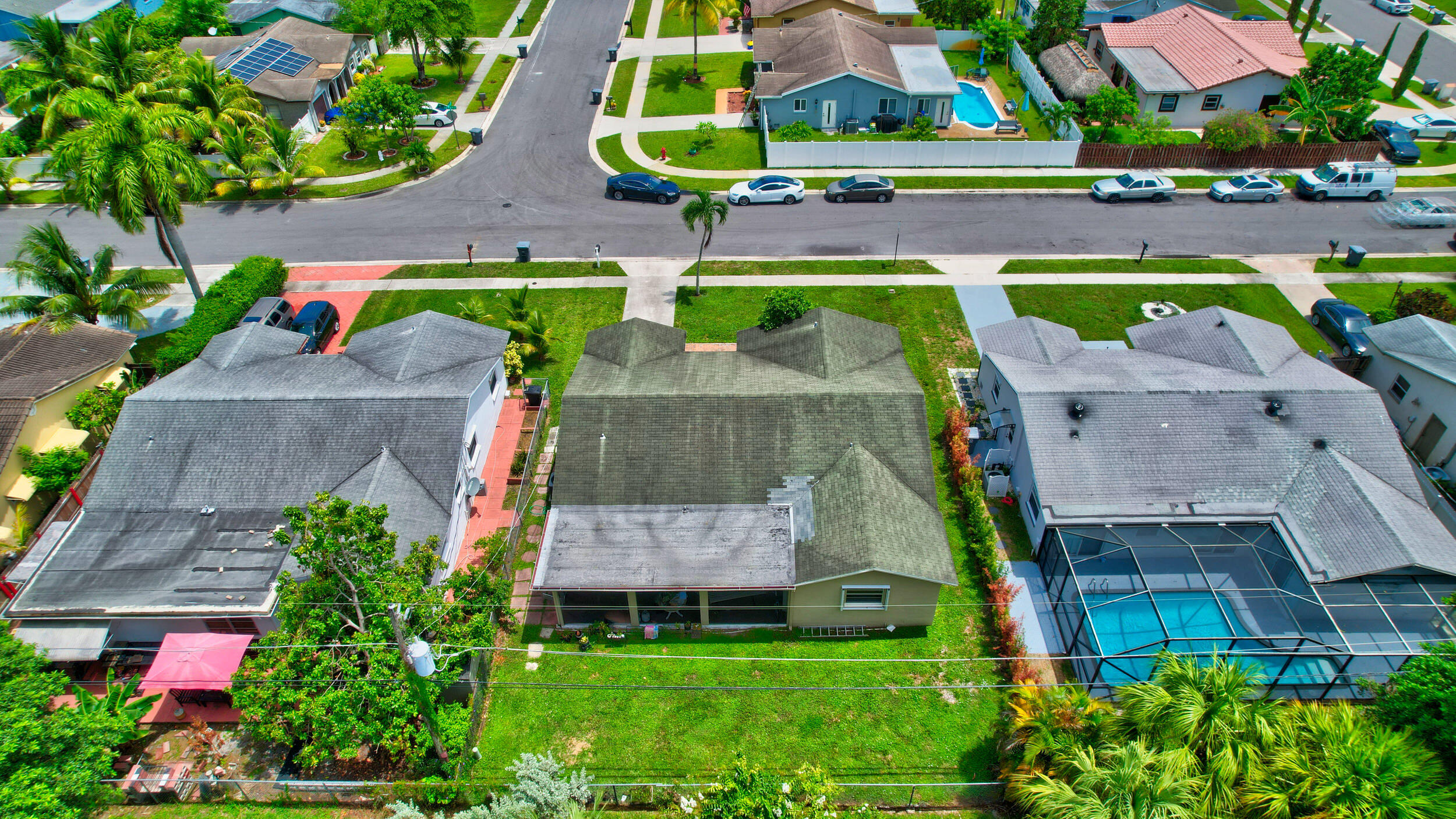 22093 Southwest 58th Avenue Boca Raton, FL 33428 - Photo 2 of 36 an aerial view of a house with a garden and plants