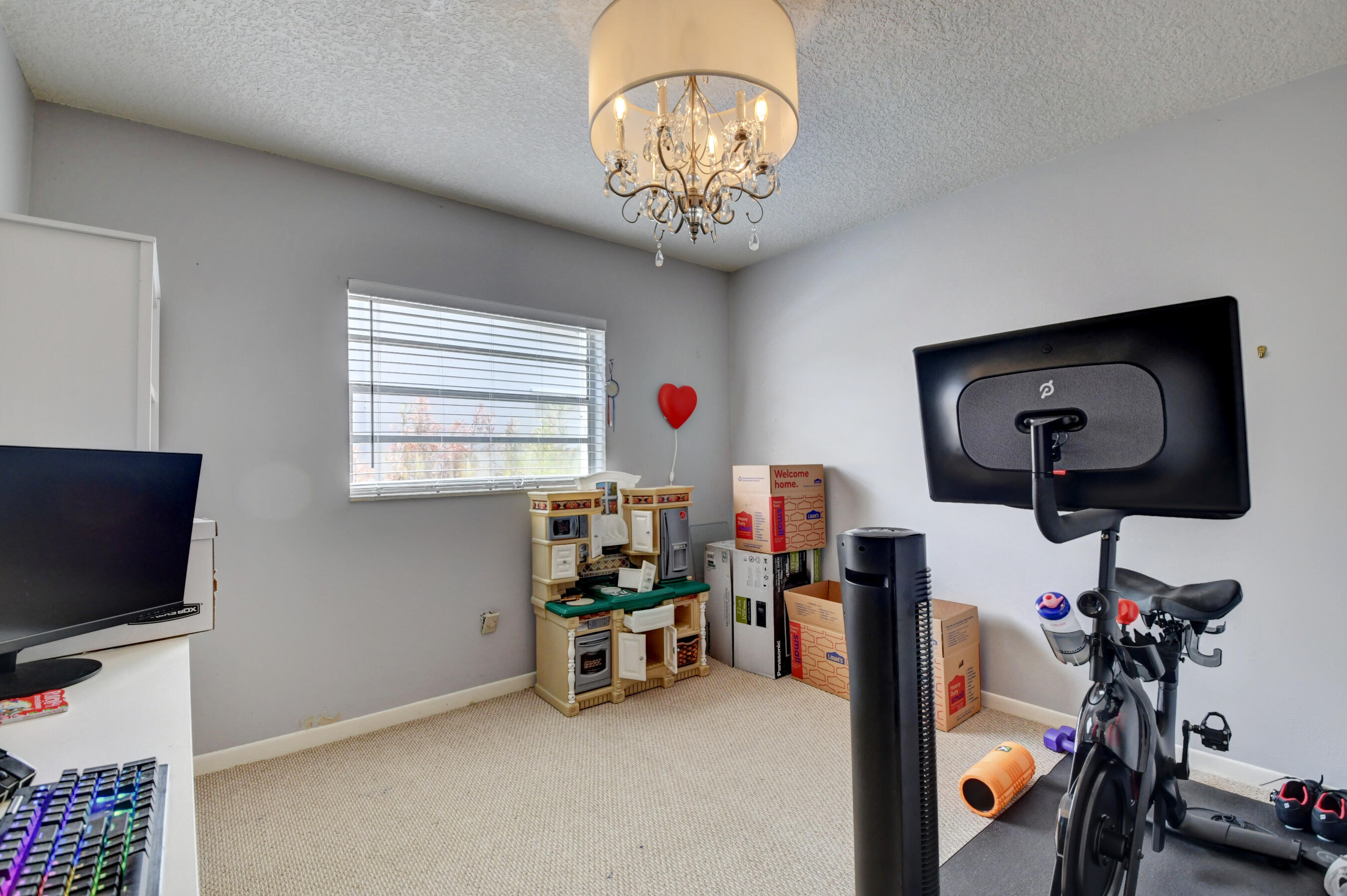 22093 Southwest 58th Avenue Boca Raton, FL 33428 - Photo 21 of 36 a room with furniture and flat screen tv