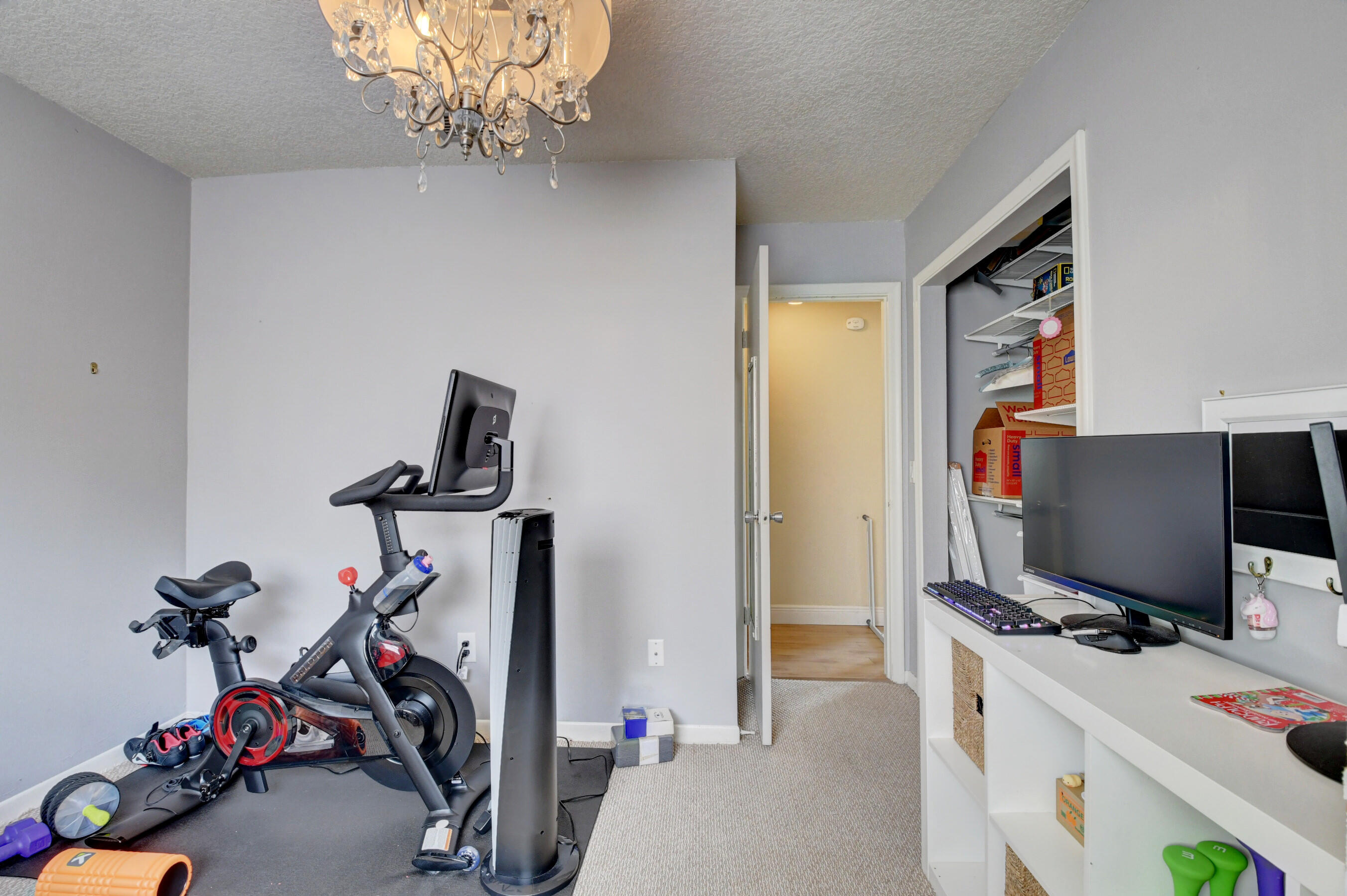 22093 Southwest 58th Avenue Boca Raton, FL 33428 - Photo 22 of 36 a view of a workspace with furniture and a window