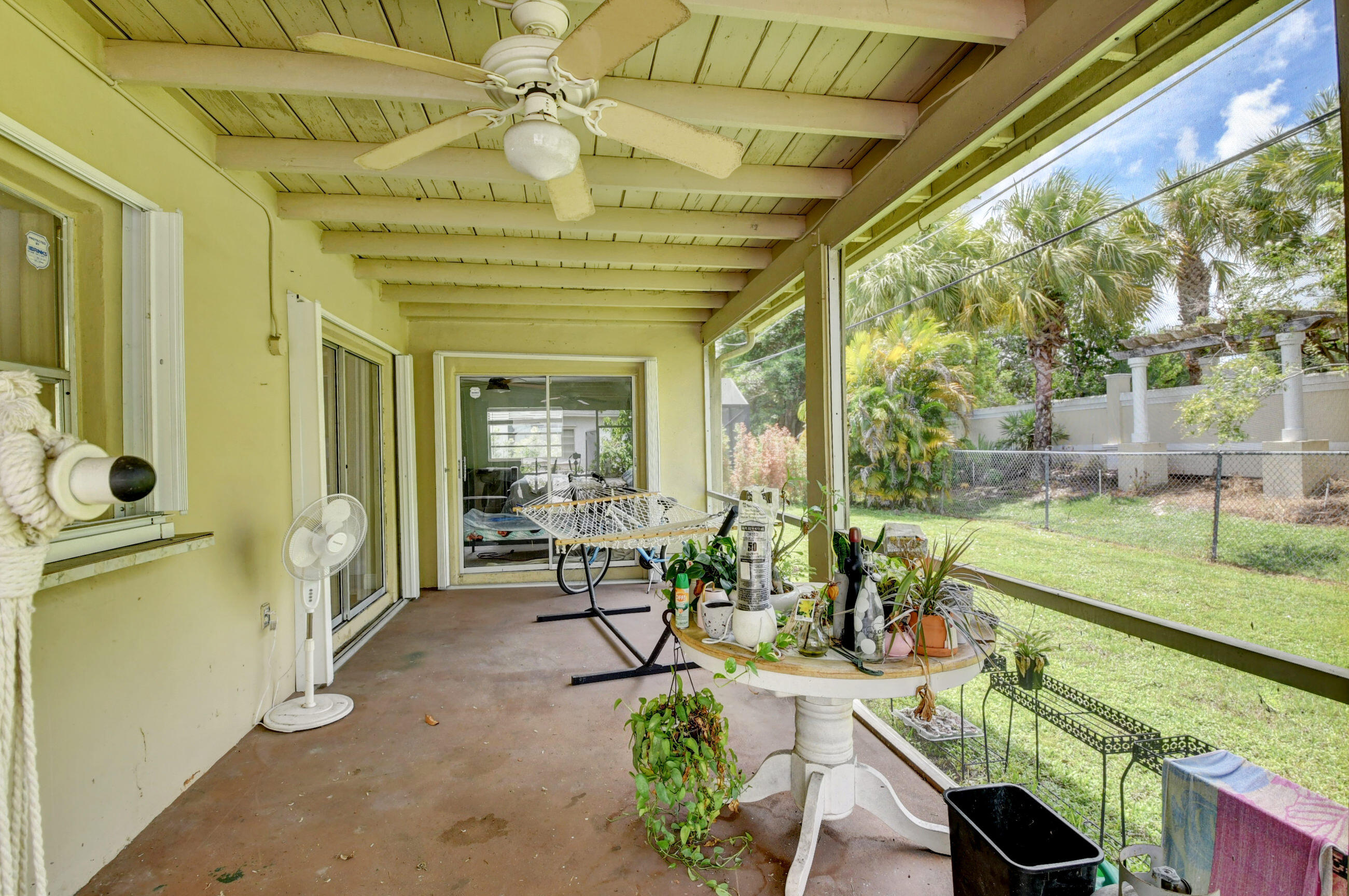 22093 Southwest 58th Avenue Boca Raton, FL 33428 - Photo 25 of 36 a living room with large windows