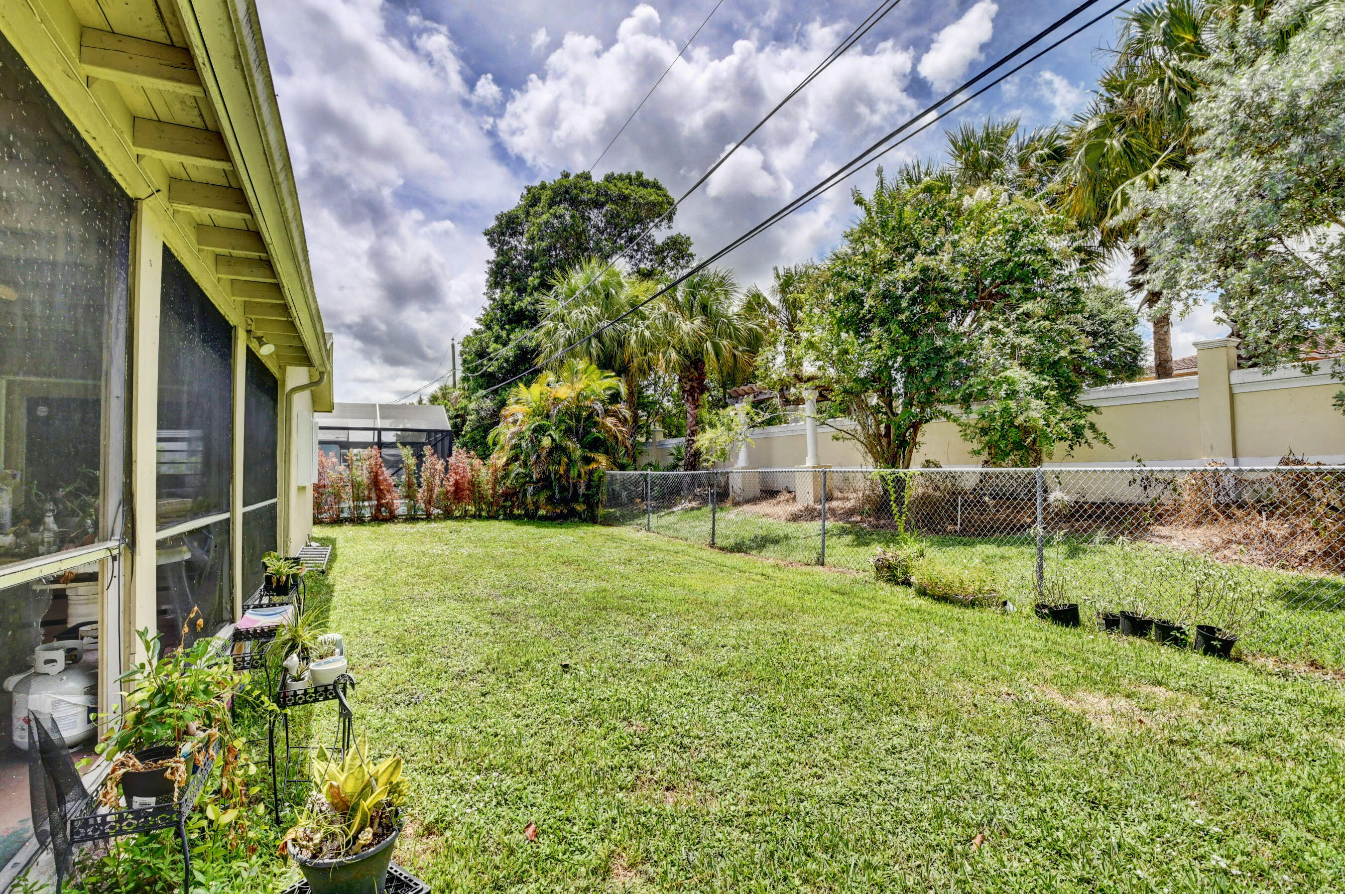 22093 Southwest 58th Avenue Boca Raton, FL 33428 - Photo 27 of 36 a view of backyard of house