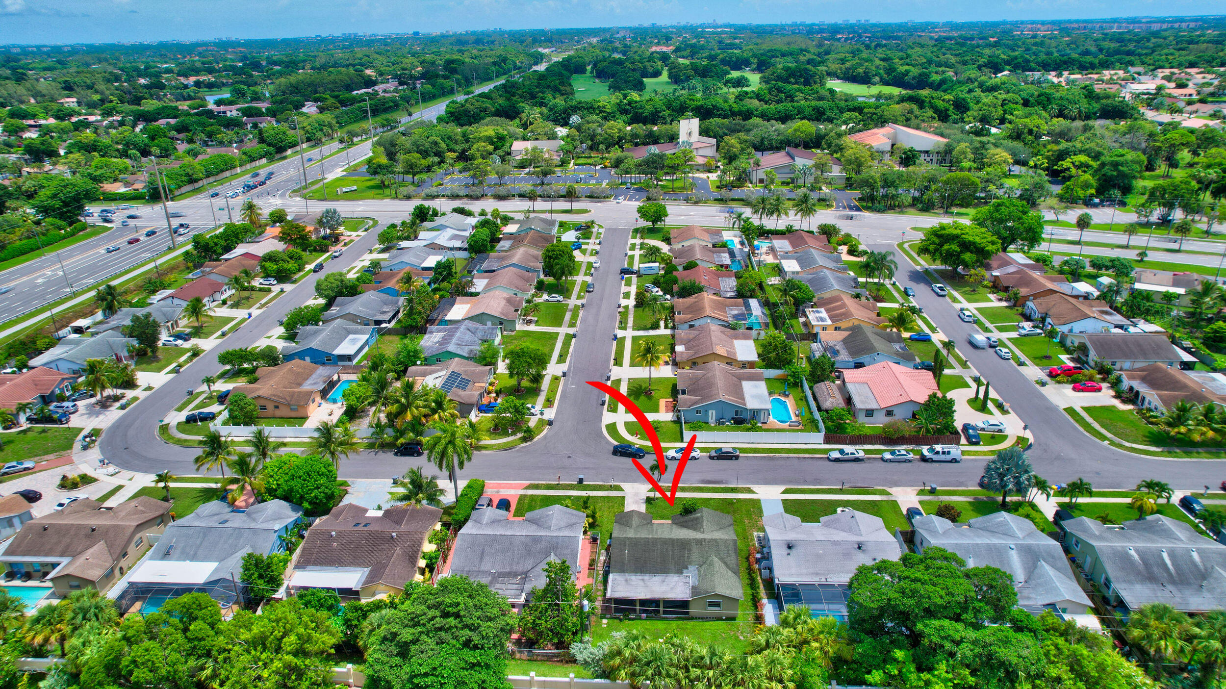 22093 Southwest 58th Avenue Boca Raton, FL 33428 - Photo 34 of 36 an aerial view of multiple houses with outdoor space and street view
