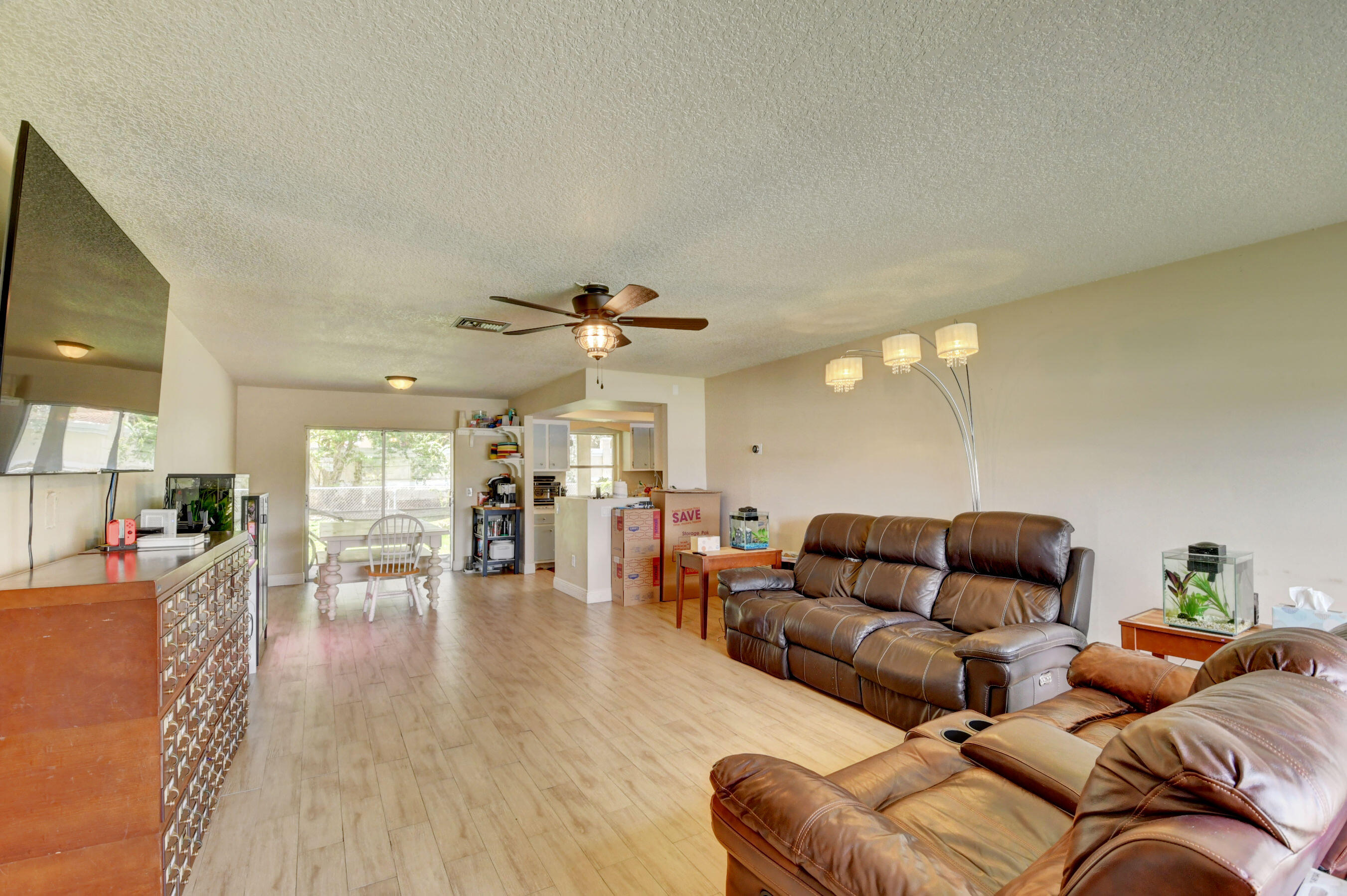 22093 Southwest 58th Avenue Boca Raton, FL 33428 - Photo 8 of 36 a living room with furniture and wooden floor