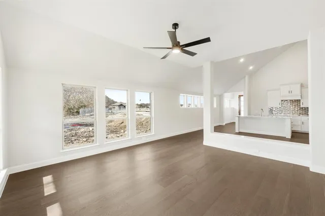 a view of a kitchen with a sink and a window