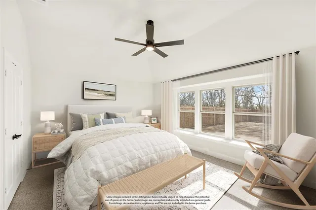 a bedroom with a bed and glass window