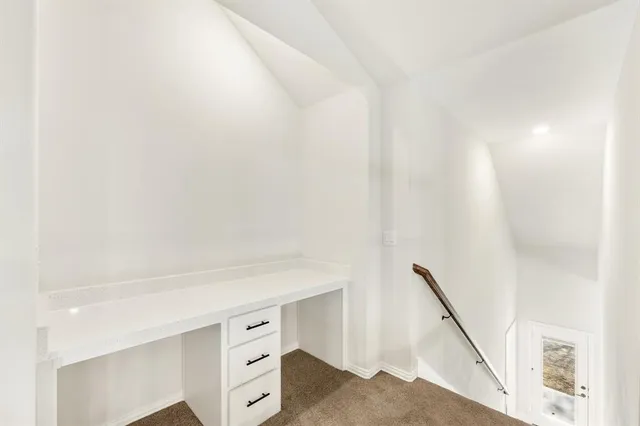 a view of white cabinets and a sink