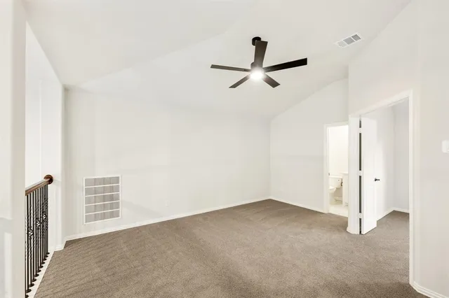 a view of a livingroom with a ceiling fan and entryway