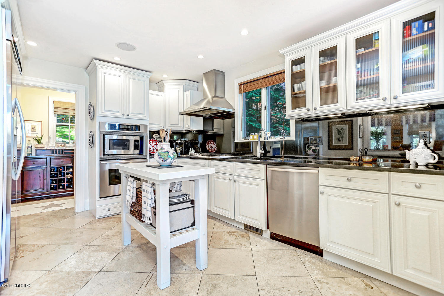 36 Arch Street Riverside, CT 06878 - Photo 12 of 37 a kitchen with stainless steel appliances granite countertop a stove and cabinets