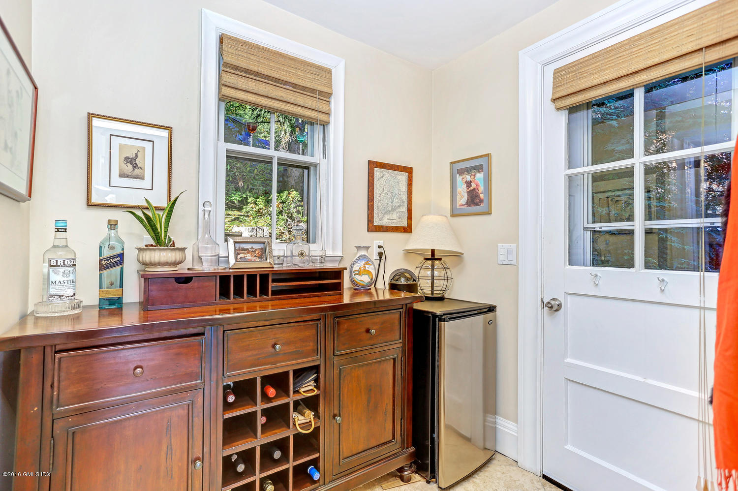 36 Arch Street Riverside, CT 06878 - Photo 16 of 37 a kitchen with stainless steel appliances a sink and a large window