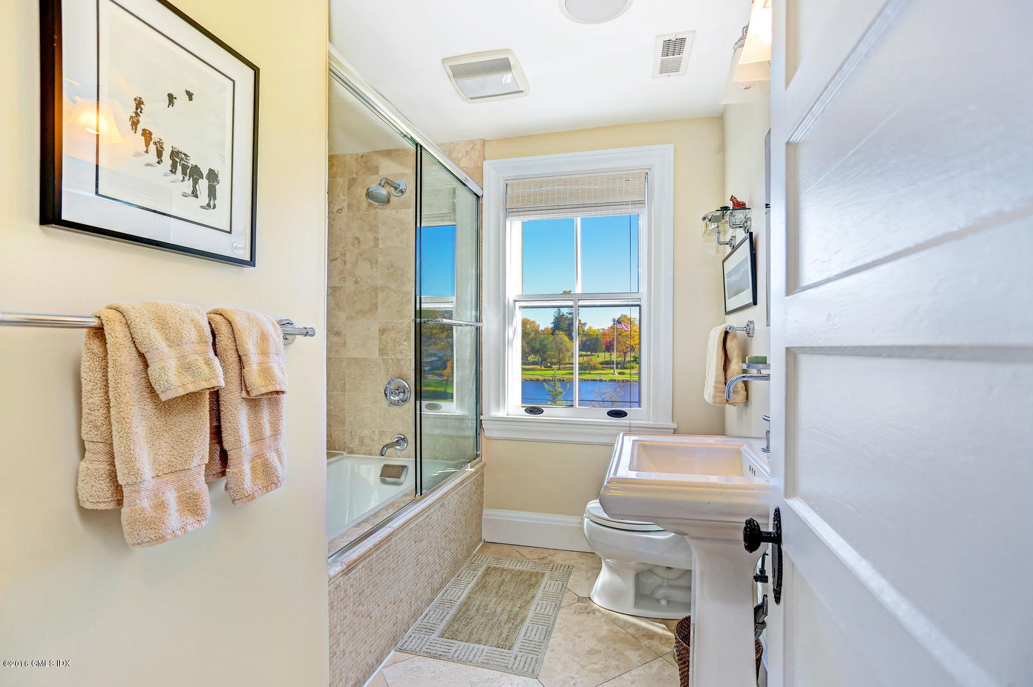 36 Arch Street Riverside, CT 06878 - Photo 19 of 37 a bathroom with a sink toilet and shower