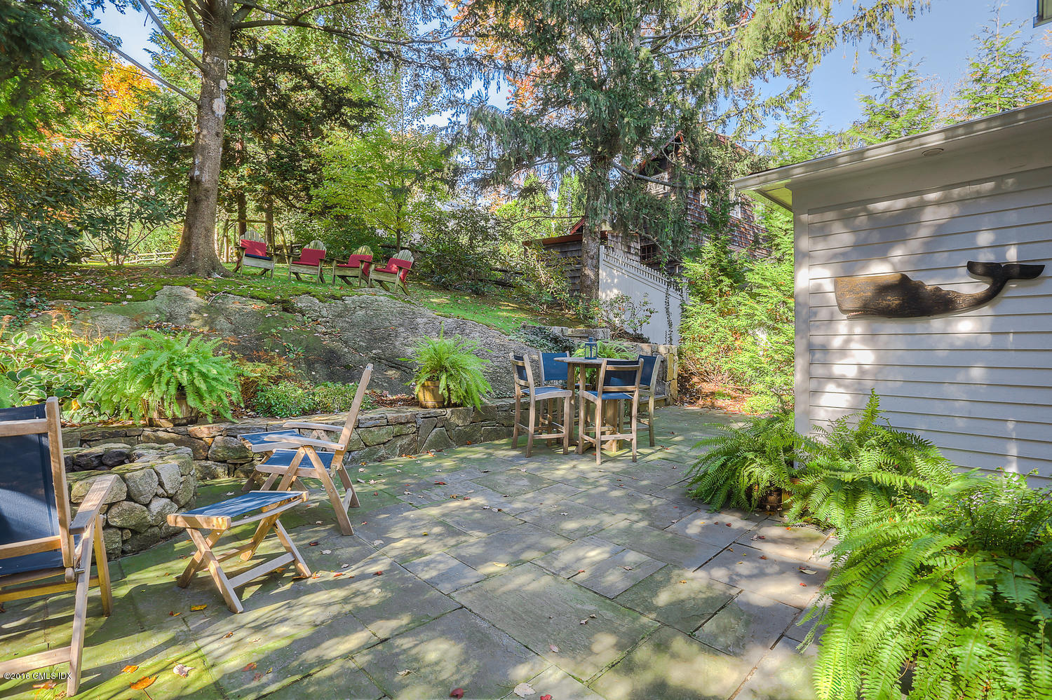 36 Arch Street Riverside, CT 06878 - Photo 26 of 37 a view of backyard with table and chairs and potted plants