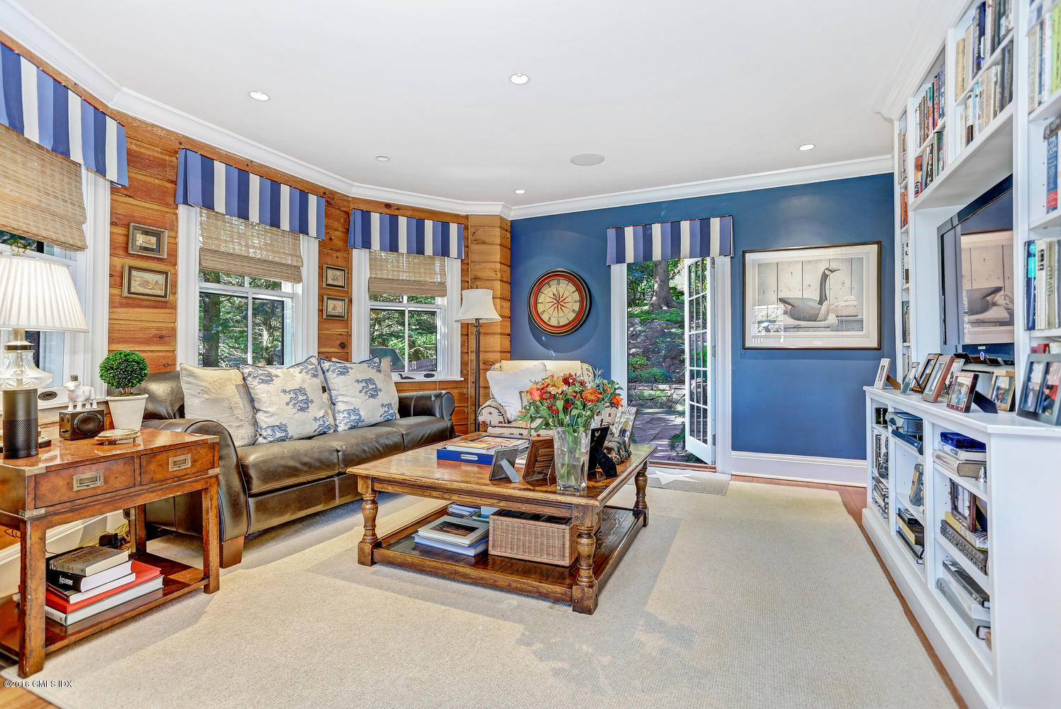 36 Arch Street Riverside, CT 06878 - Photo 7 of 37 a living room with furniture and a flat screen tv