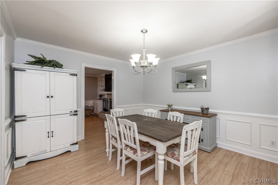 13907 Barnes Spring Road Midlothian, VA 23112 - Photo 13 of 43 a view of a dining room with furniture and wooden floor