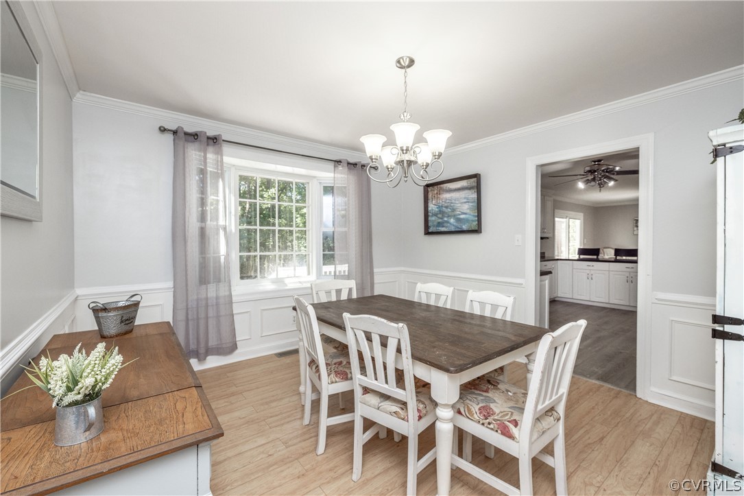 13907 Barnes Spring Road Midlothian, VA 23112 - Photo 14 of 43 a view of a dining room with furniture wooden floor and chandelier