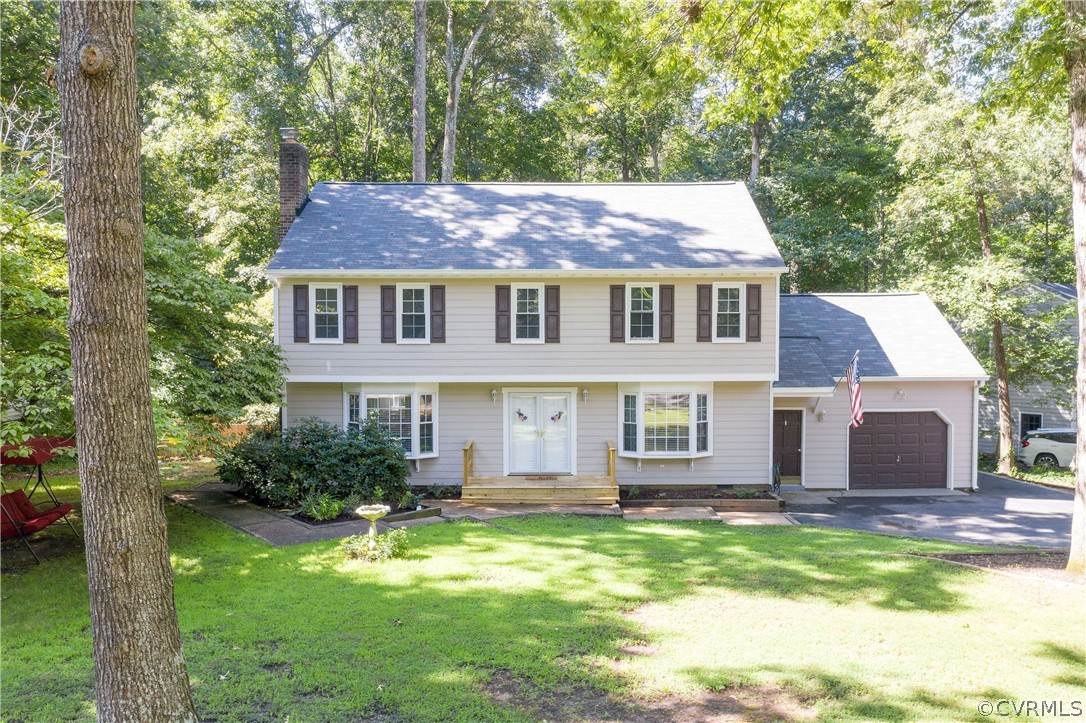 13907 Barnes Spring Road Midlothian, VA 23112 - Photo 2 of 43 a backyard of a house with yard table and chairs