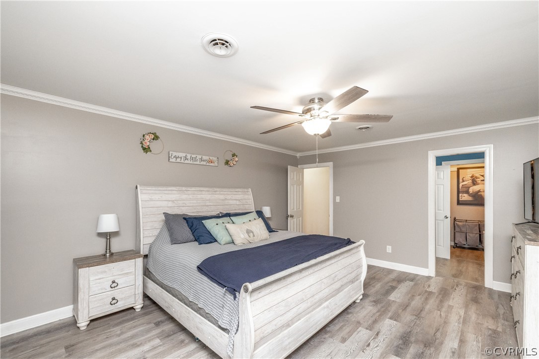 13907 Barnes Spring Road Midlothian, VA 23112 - Photo 21 of 43 a bedroom with a bed and a ceiling fan