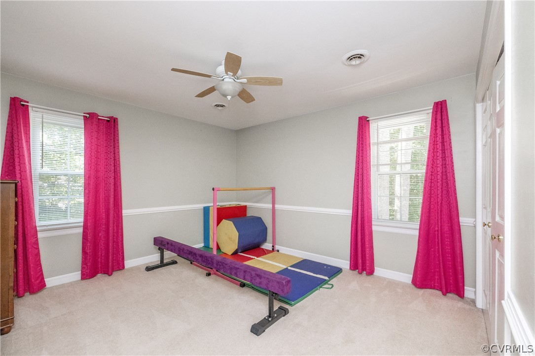 13907 Barnes Spring Road Midlothian, VA 23112 - Photo 28 of 43 a room with furniture and a wooden floor