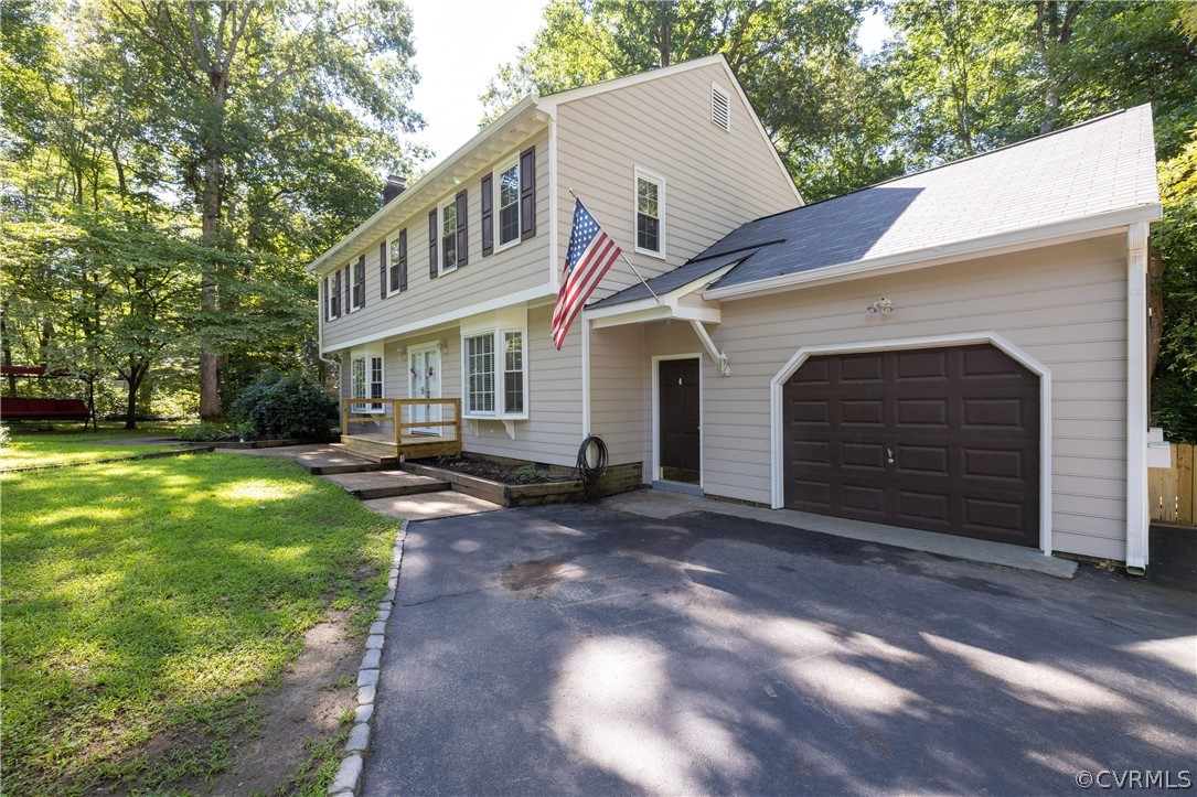 13907 Barnes Spring Road Midlothian, VA 23112 - Photo 3 of 43 a front view of a house with a yard