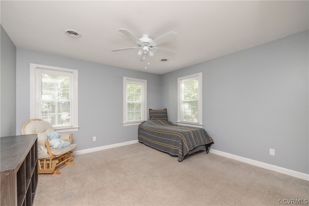 13907 Barnes Spring Road Midlothian, VA 23112 - Photo 31 of 43 a spacious bedroom with a bed and a window