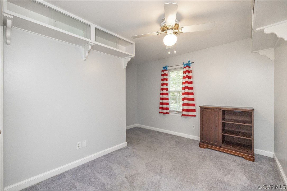 13907 Barnes Spring Road Midlothian, VA 23112 - Photo 34 of 43 a view of an empty room with a fan and a window