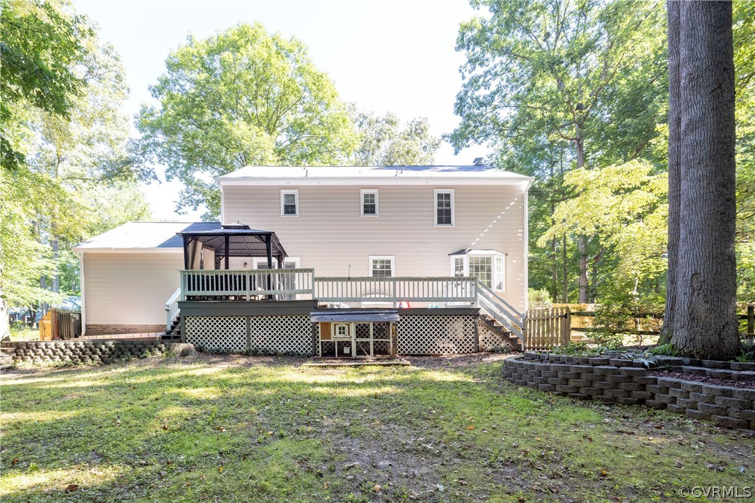 13907 Barnes Spring Road Midlothian, VA 23112 - Photo 40 of 43 a front view of a house with a garden and deck