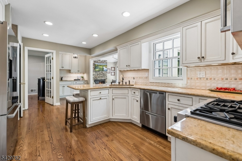 738 Springfield Avenue Summit, NJ 07901 - Photo 13 of 29 a kitchen with a sink a stove a refrigerator and cabinets
