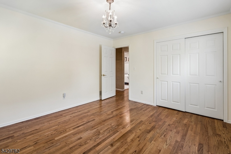 738 Springfield Avenue Summit, NJ 07901 - Photo 19 of 29 a view of an empty room with wooden floor