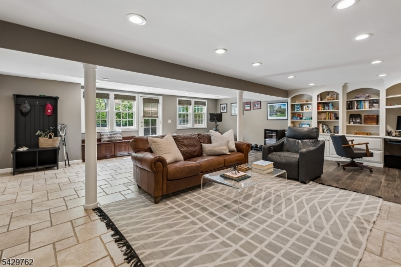 738 Springfield Avenue Summit, NJ 07901 - Photo 23 of 29 a living room with furniture and a flat screen tv