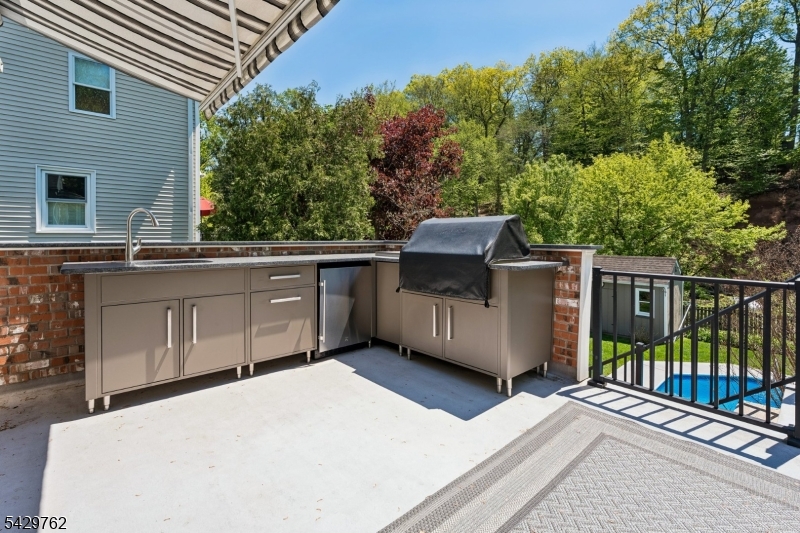 738 Springfield Avenue Summit, NJ 07901 - Photo 24 of 29 a view of a house with a sink and backyard