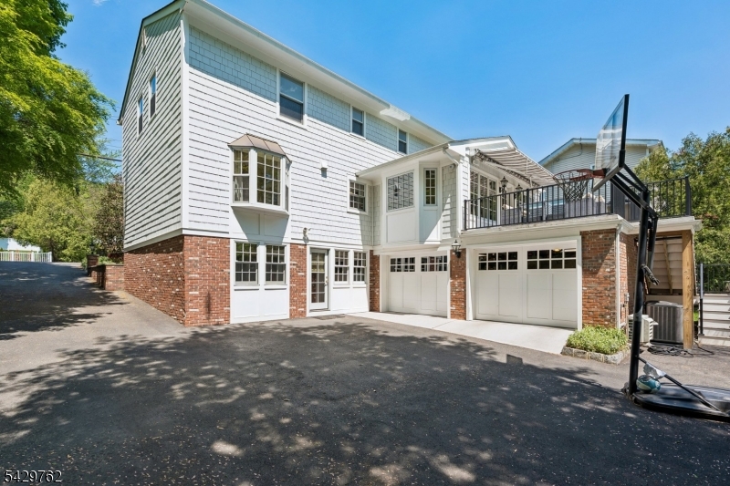738 Springfield Avenue Summit, NJ 07901 - Photo 27 of 29 a front view of a house with a garage