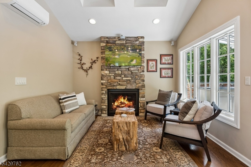 738 Springfield Avenue Summit, NJ 07901 - Photo 9 of 29 a living room with furniture and a fireplace