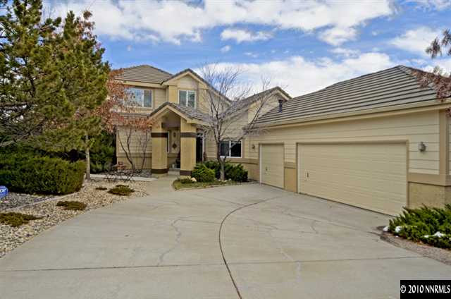 2205 Snowmass Drive Reno, NV 89511 - Photo 1 of 9 a view of a white house with a outdoor space and a car park in front of it
