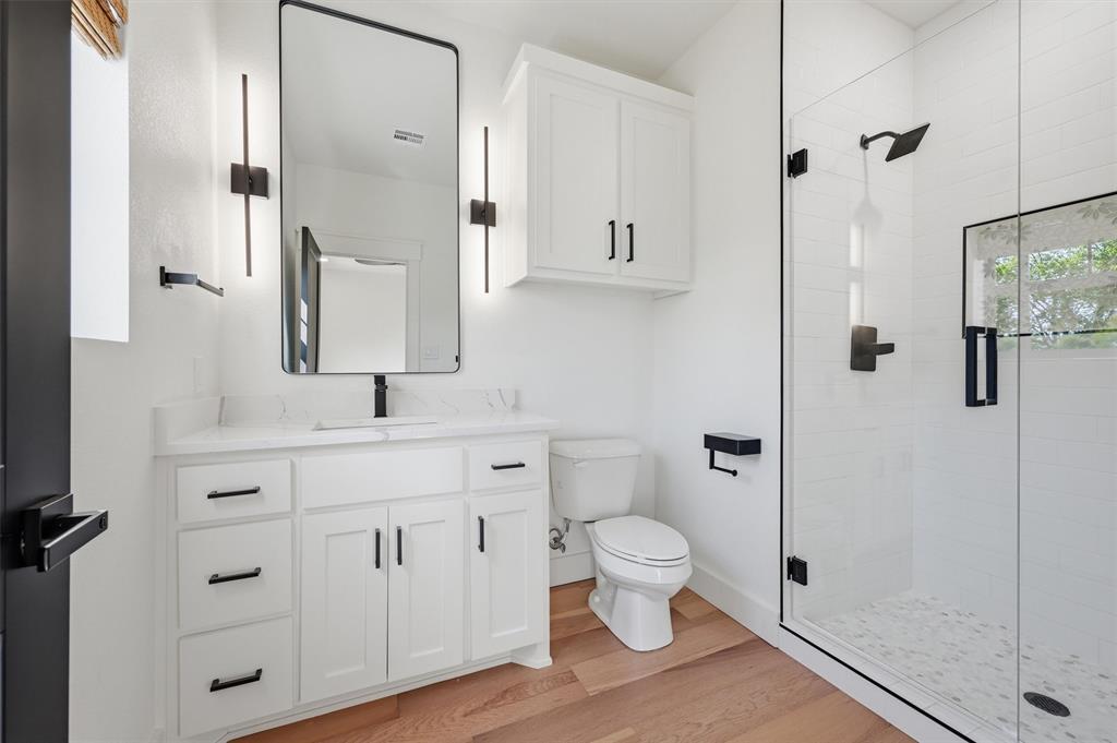 1805 Arthur Road Denison, TX 75021 - Photo 34 of 40 a bathroom with a sink a toilet and shower