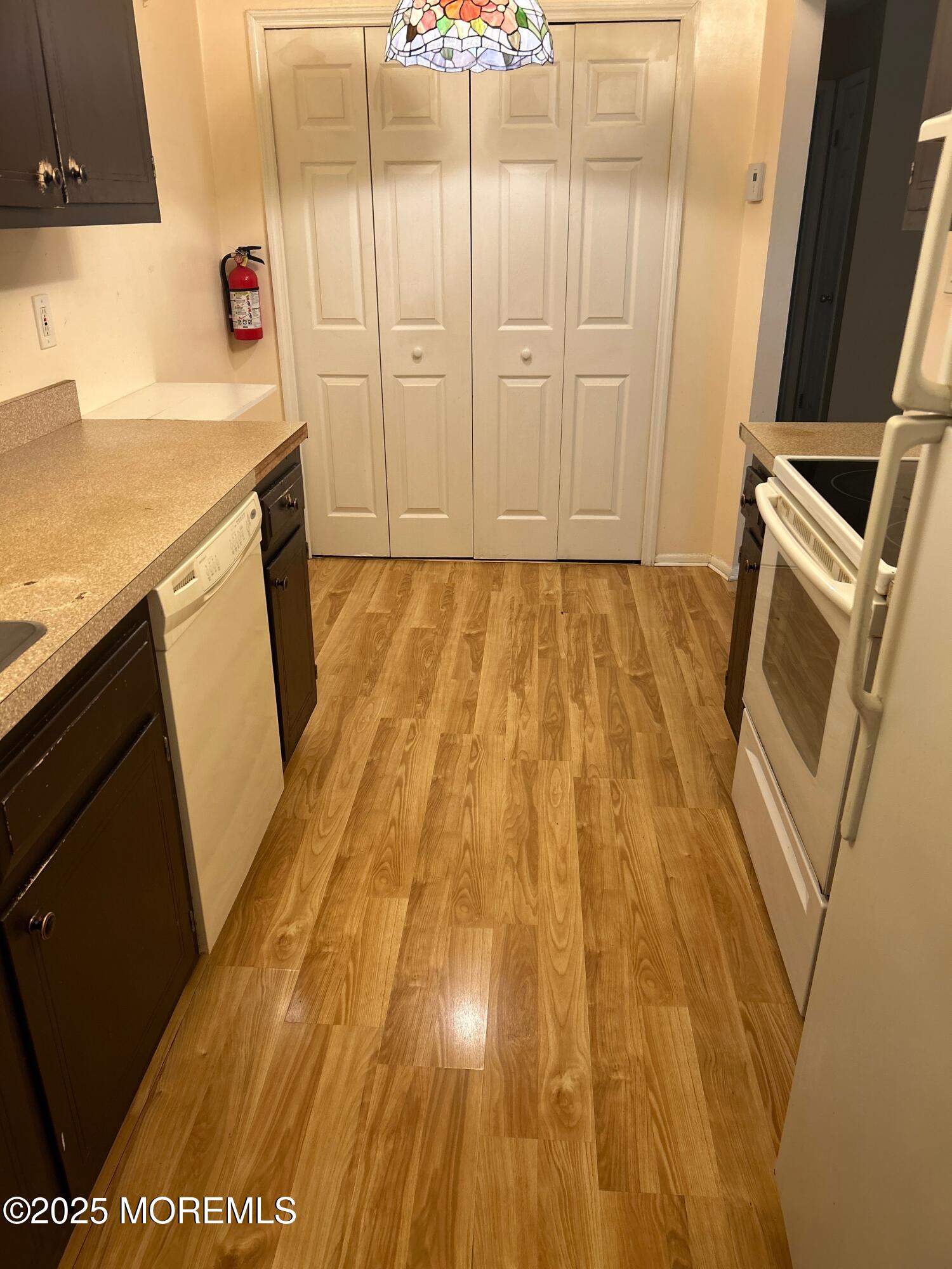 71 Overlook Way, Unit H Manalapan, NJ 07726 - Photo 2 of 5 a bathroom with a sink and a mirror