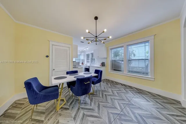 a dining room with furniture and window