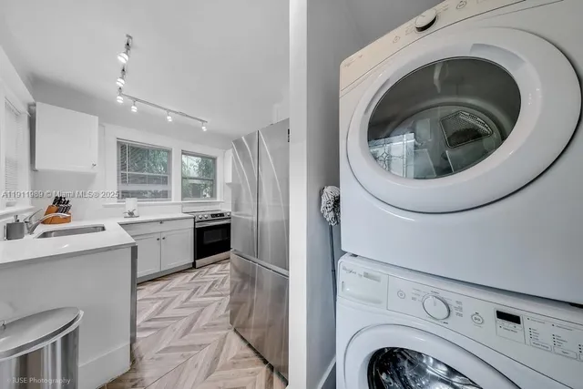 a view of a kitchen with washer and dryer