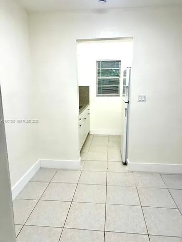 a view of a room that has a window in it