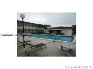 a view of swimming pool from a balcony