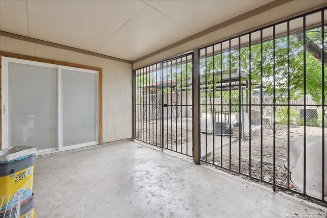 a view of a patio with table and chairs and potted plants