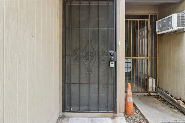 a living room with furniture a rug and a window