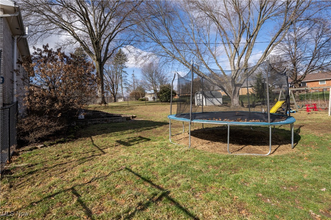 3721 20th Street Northwest Canton, OH 44708 - Photo 31 of 47 View of yard with a playground and a trampoline
