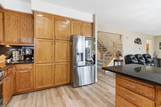 a living room with fireplace furniture and a fireplace