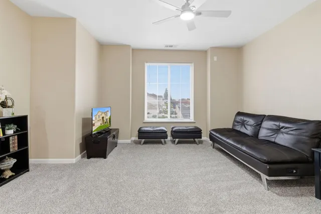 a view of a hallway with wooden floor and entryway