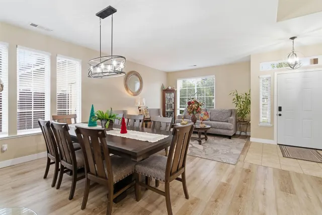 a kitchen with kitchen island granite countertop wooden cabinets and a stove top oven