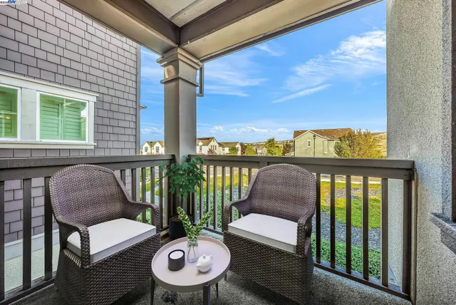 a utility room with washing machine and a microwave
